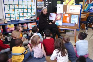 Syracuse student working with children in Syracuse City School District. 